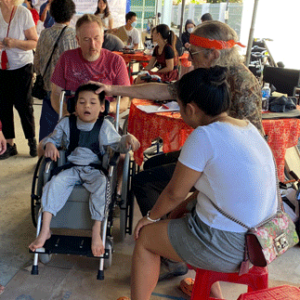 Occupational Therapist Jim Hermeling helps fit wheelchairs for patients in Vietnam it Hope Haven