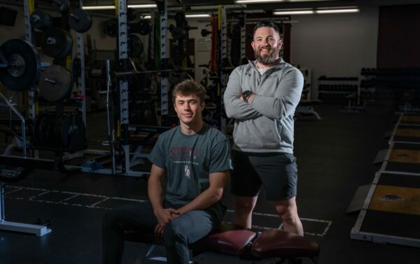 Spearfish High School track athlete Jaden Guthmiller with Monument Health Strength and Conditioning Coach Eric Santure