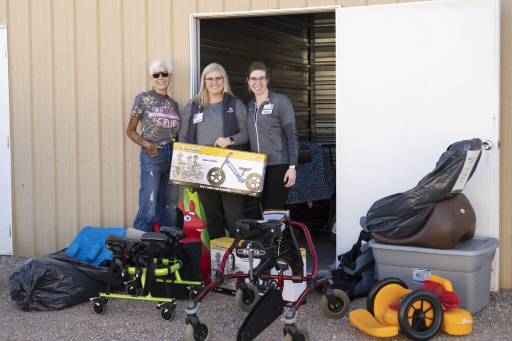 Three women with adaptive equipment