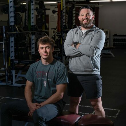 Spearfish High School track athlete Jaden Guthmiller with Monument Health Strength and Conditioning Coach Eric Santure