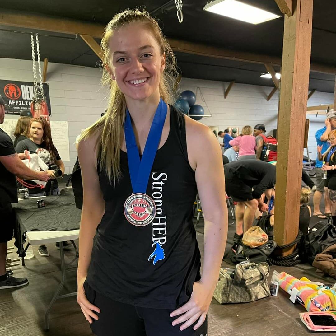 Monument Health caregiver breaks two South Dakota powerlifting records